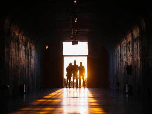 The Lagina family in the solstice tunnel during sunrise