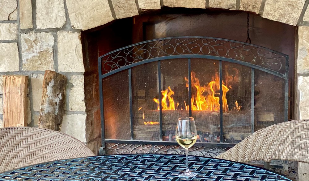 A wine glass near the fire outside