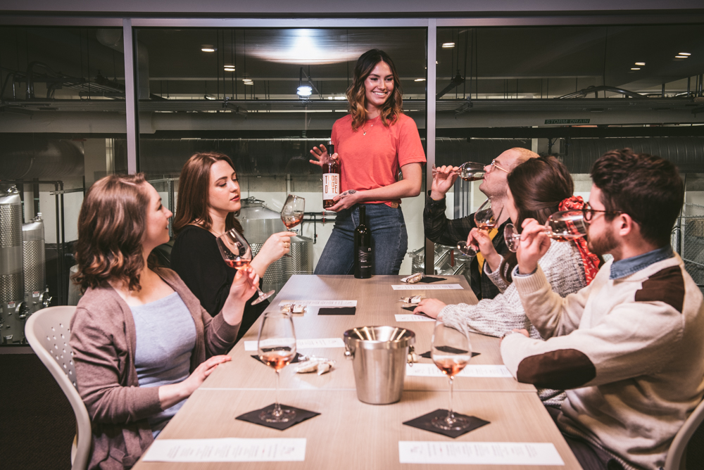Happy group of friends enjoys a tasting on Mari's mezzanine level
