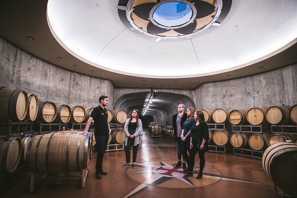 Guests on a tour in the wine caves under the oculus 